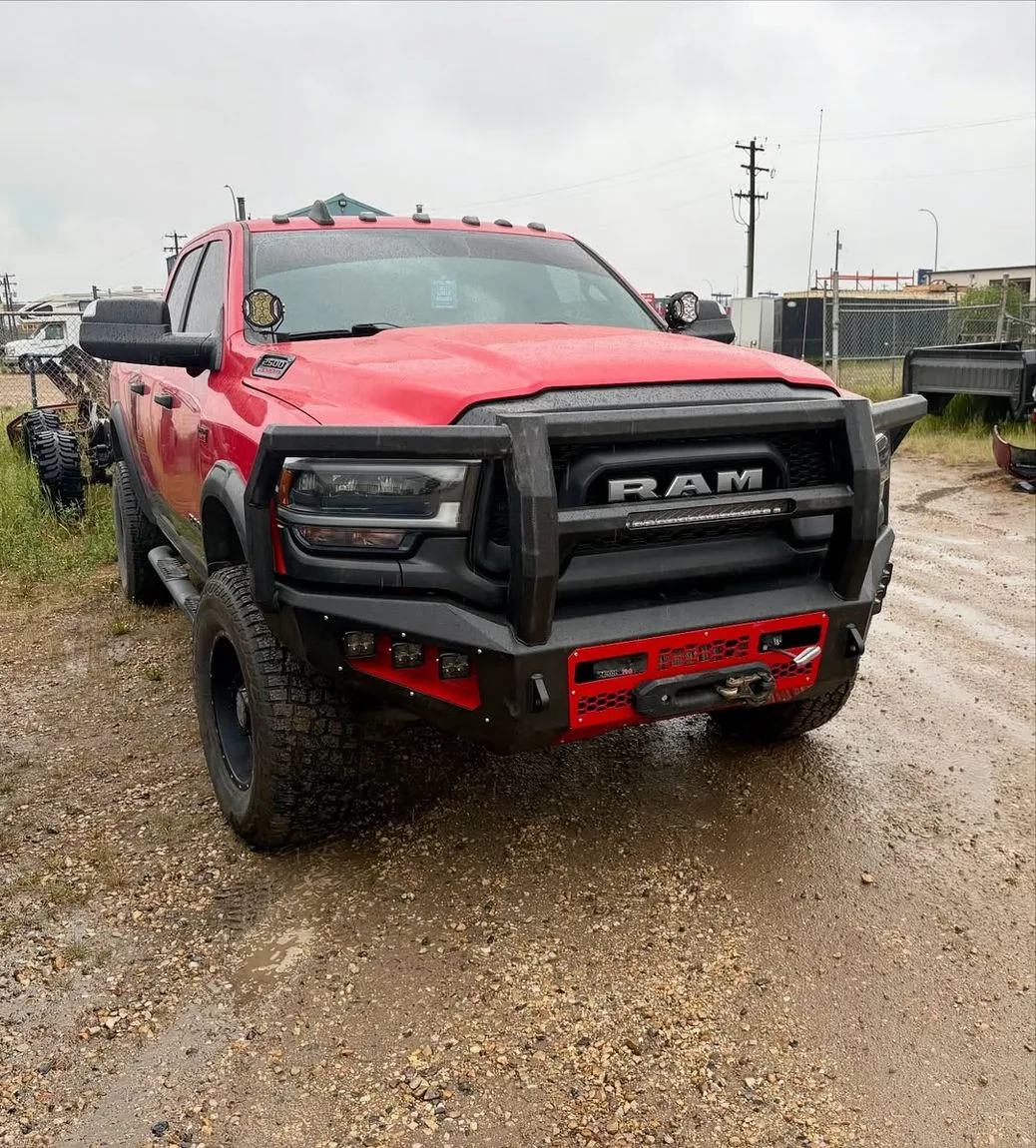 Custom front bumper and grille guard on a lifted RAM at a Grande Prairie shop