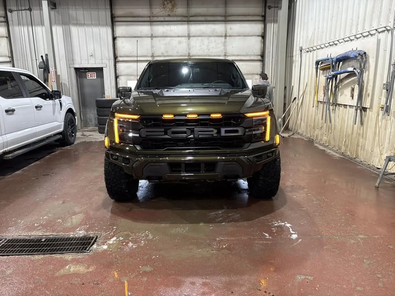 Custom olive-green Ford Raptor refinished in Grande Prairie